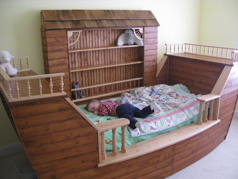 9' long Noah's Ark Bed with storage and bookshelves.